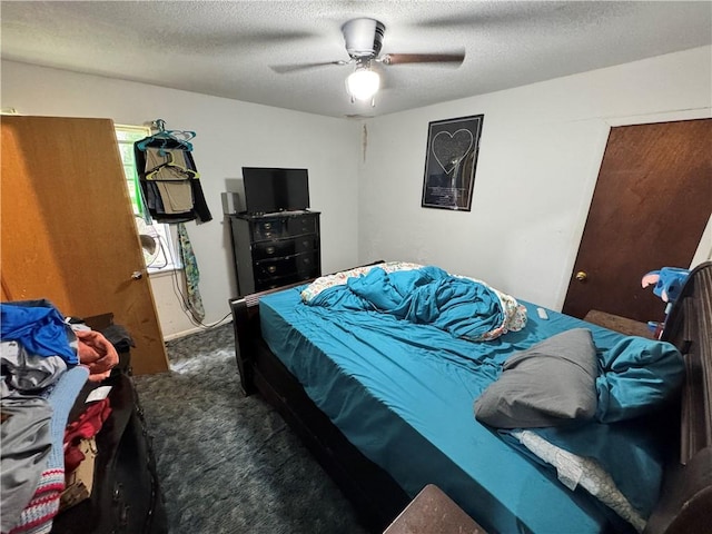 11485 US Highway 29, Tuskegee, AL 36803 - bedroom featuring carpet flooring, a ceiling fan, and a textured ceiling
