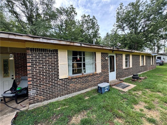 11485 US Highway 29, Tuskegee, AL 36803 - view of front of house featuring brick siding and a front lawn