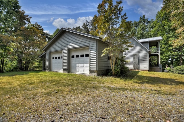 garage with a yard