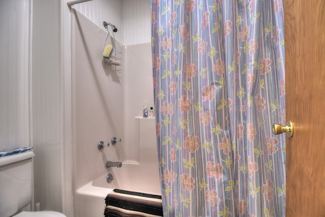 bathroom with toilet and shower / bathtub combination with curtain