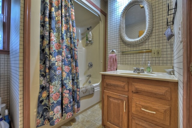 bathroom with shower / tub combo and vanity