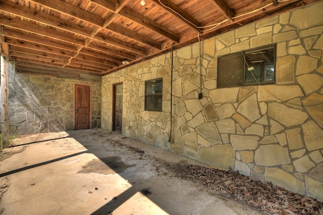 interior space with beam ceiling and wooden ceiling