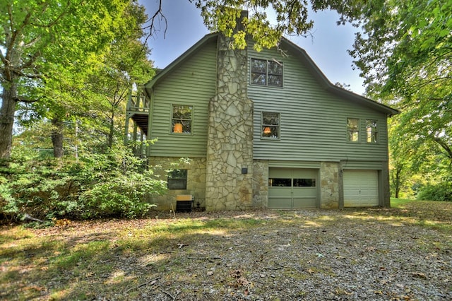 view of side of home featuring a garage