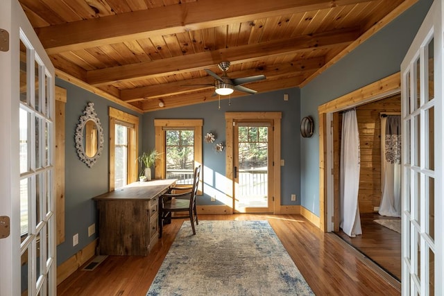 interior space with wood ceiling, ceiling fan, light hardwood / wood-style flooring, and vaulted ceiling with beams