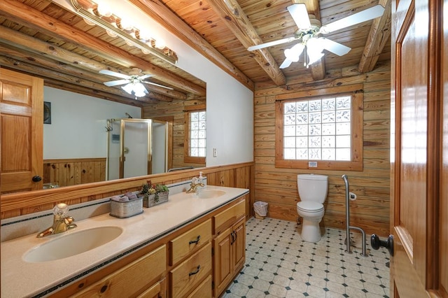 bathroom featuring wooden walls, vanity, a shower with shower door, wooden ceiling, and beamed ceiling