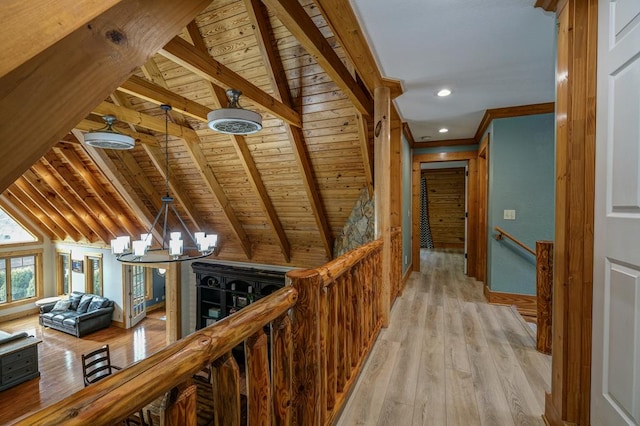 corridor featuring vaulted ceiling with beams, ornamental molding, wood ceiling, an inviting chandelier, and light hardwood / wood-style flooring