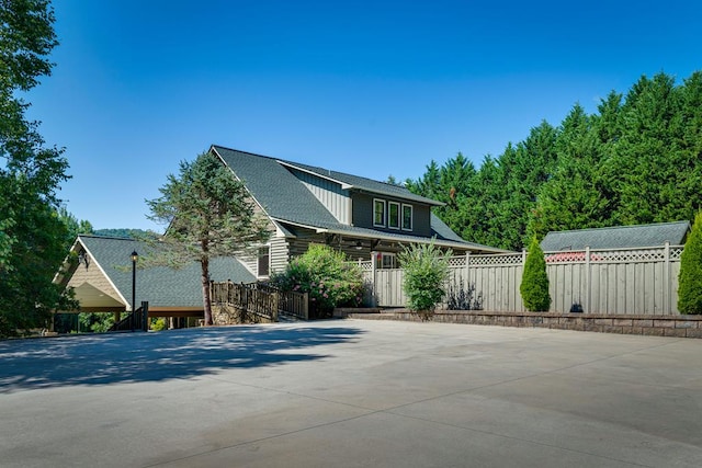 view of property exterior with a carport