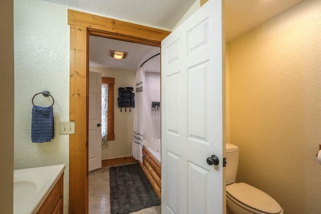 full bathroom with vanity, toilet, and shower / bath combo with shower curtain