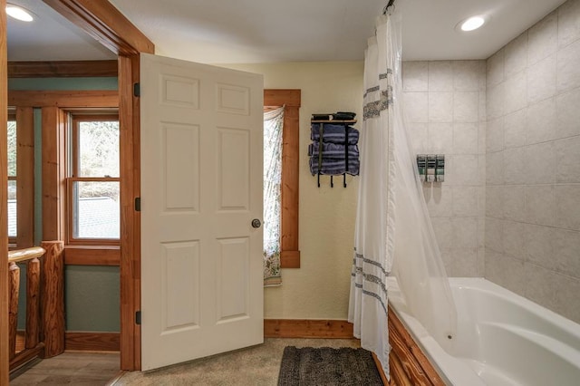 bathroom featuring shower / tub combo with curtain