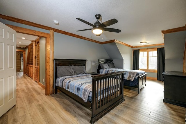 bedroom featuring crown molding, ceiling fan, and light hardwood / wood-style flooring