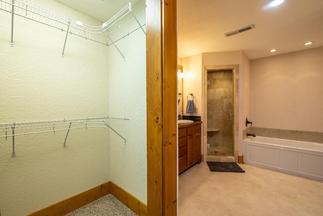 walk in closet featuring sink