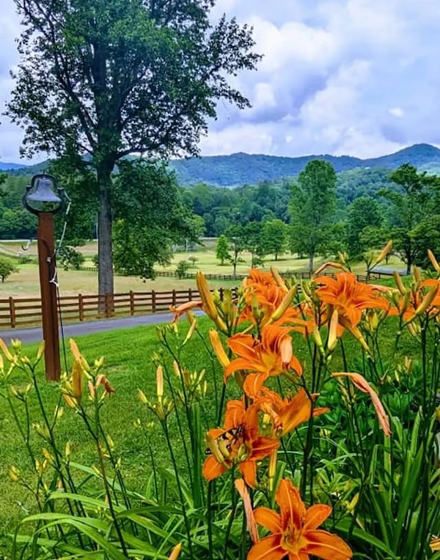 exterior space with fence and a mountain view