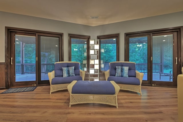 sitting room with wood-type flooring