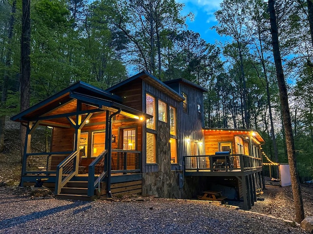 view of front of property with a porch and a deck