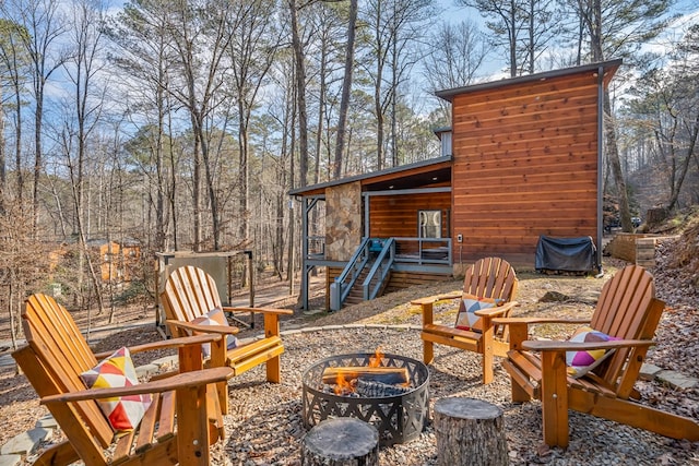 view of patio / terrace with a fire pit