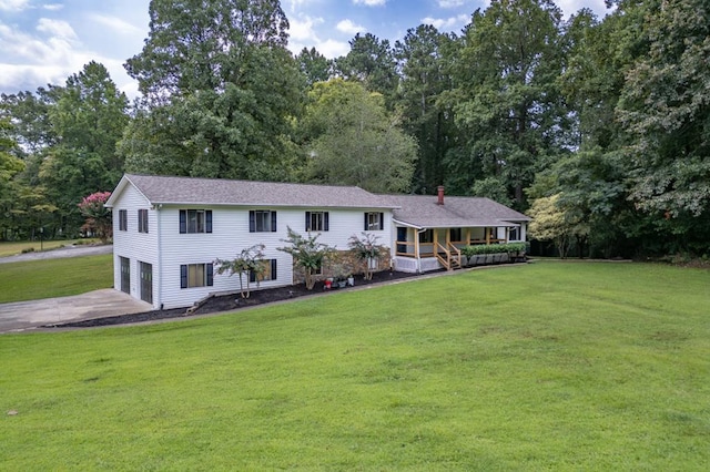 view of front facade with a garage and a front lawn