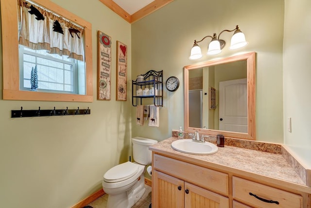 bathroom with an enclosed shower, vanity, and toilet