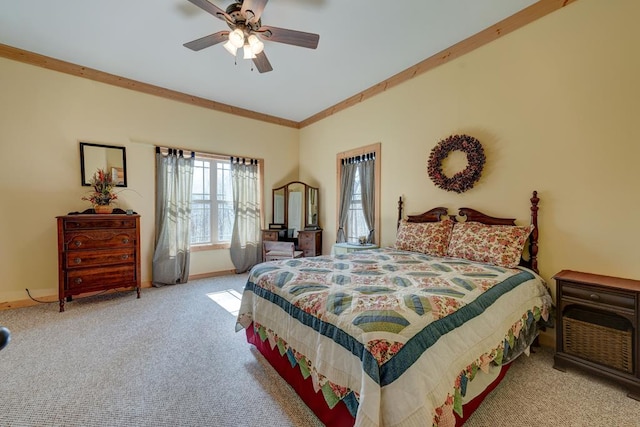 bedroom with ceiling fan, light carpet, and crown molding