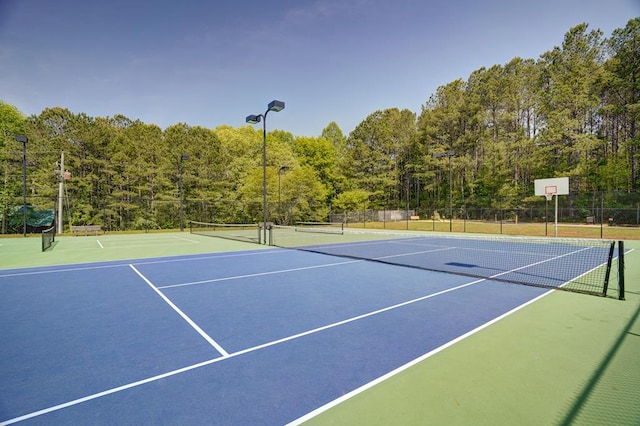 view of sport court featuring basketball hoop