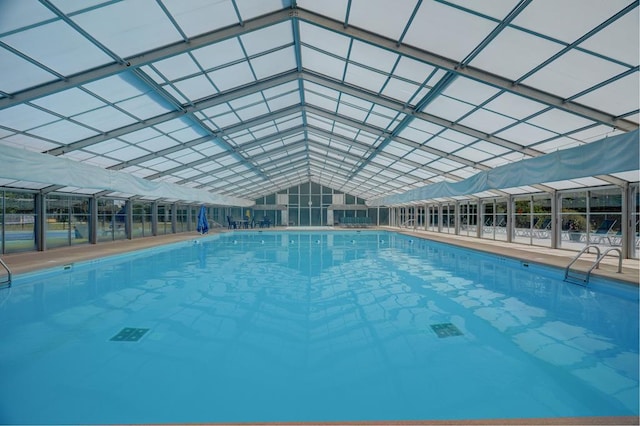 view of pool with a lanai and a patio