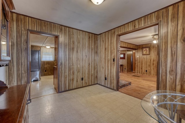 interior space with wooden walls and light floors