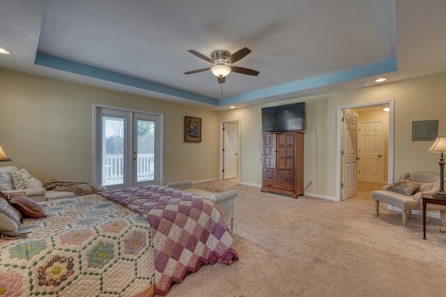 bedroom featuring ceiling fan, a raised ceiling, baseboards, light carpet, and recessed lighting