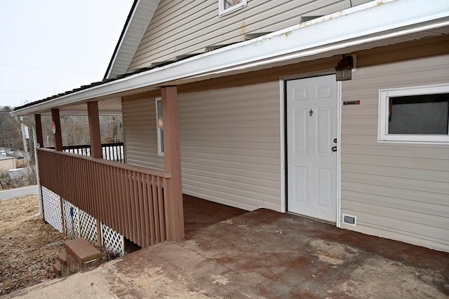 entrance to property with a patio area