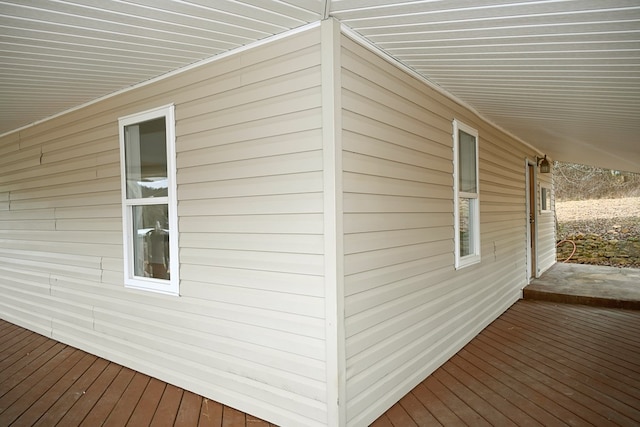 view of side of home with a wooden deck