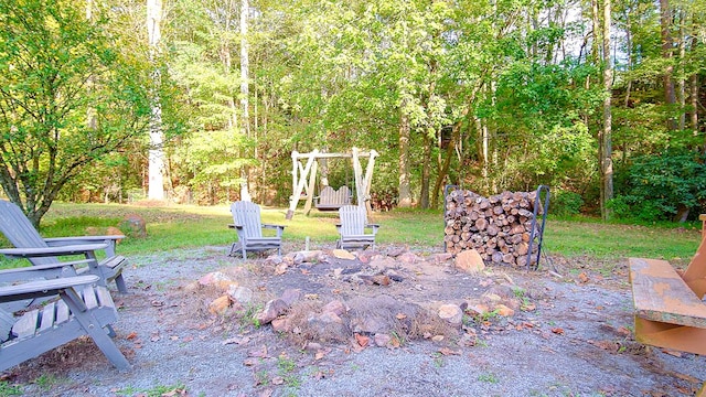 view of yard with a fire pit