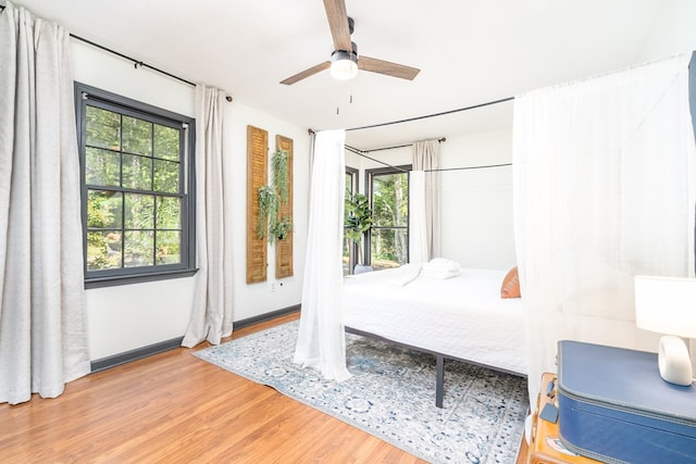 bedroom featuring a ceiling fan and wood finished floors