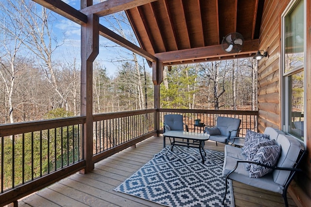 deck featuring ceiling fan and outdoor lounge area