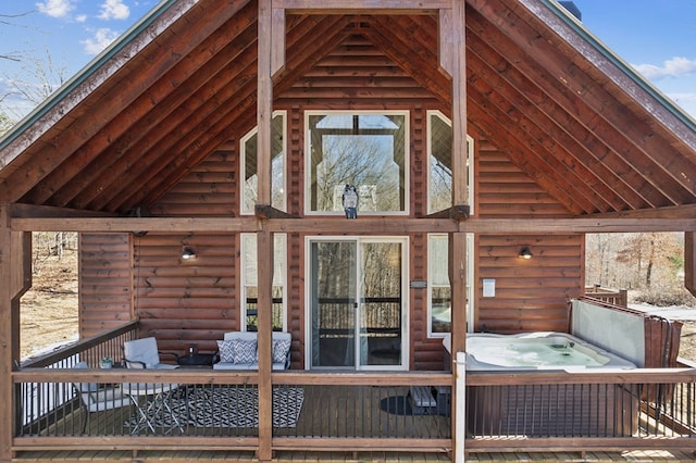 exterior space featuring a hot tub