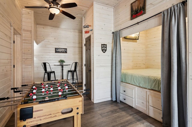 recreation room featuring wooden ceiling, dark wood-type flooring, and wood walls