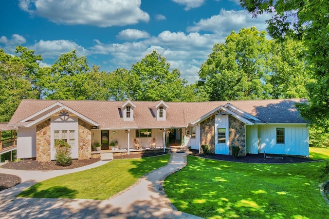 view of front of house featuring a front yard and covered porch