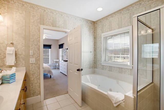 bathroom with vanity, a tub with jets, wallpapered walls, a shower stall, and tile patterned floors