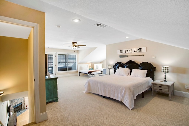 bedroom featuring visible vents, light carpet, a textured ceiling, recessed lighting, and baseboards