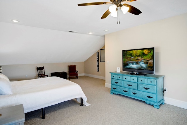 bedroom with visible vents, light carpet, baseboards, and vaulted ceiling