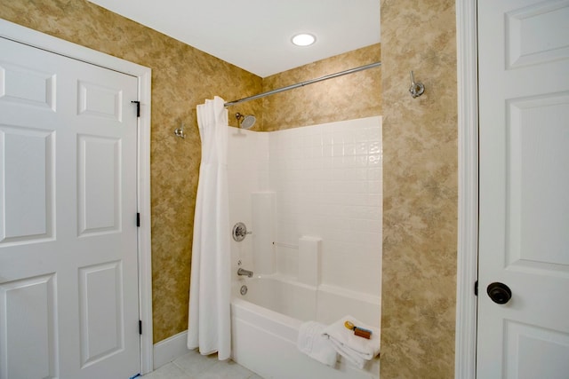 bathroom featuring tile patterned flooring, shower / bathtub combination with curtain, and wallpapered walls