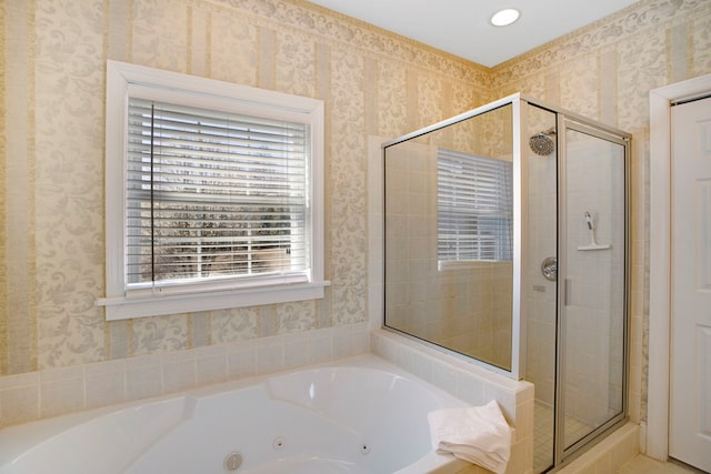 full bathroom with a jetted tub, a stall shower, and wallpapered walls