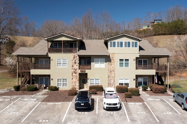 view of building exterior featuring uncovered parking