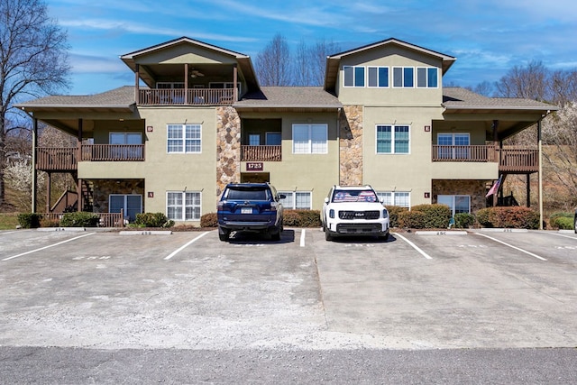 view of building exterior featuring uncovered parking