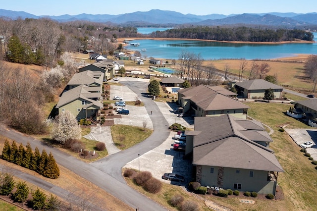 birds eye view of property featuring a residential view and a water and mountain view