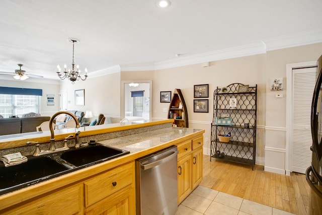 kitchen featuring tile counters, open floor plan, dishwasher, ceiling fan with notable chandelier, and a sink