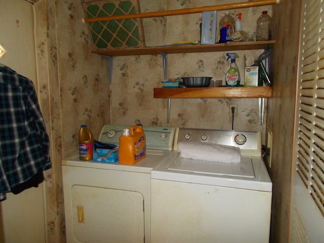 laundry room featuring separate washer and dryer and laundry area