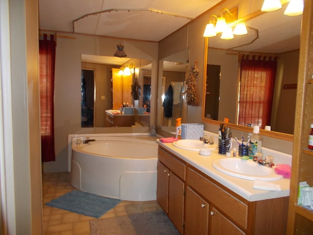 bathroom with a bath, double vanity, and a sink
