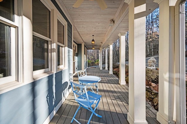 deck featuring covered porch and a ceiling fan