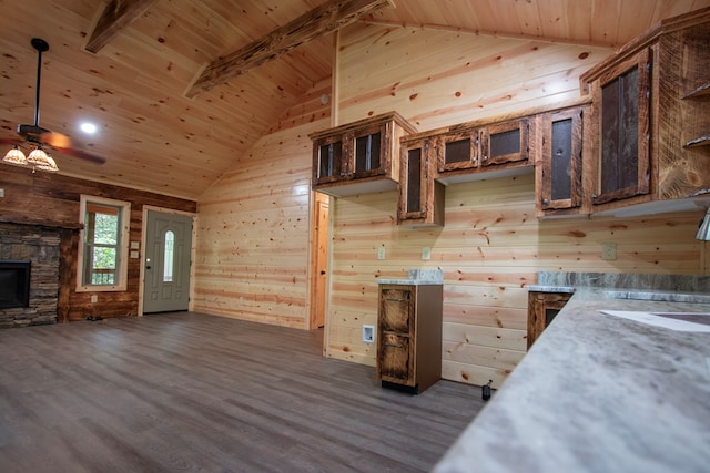 155 Stone Crest Ln, Murphy, NC 28906 - kitchen featuring wooden ceiling, wooden walls, dark wood-style floors, ceiling fan, and a fireplace