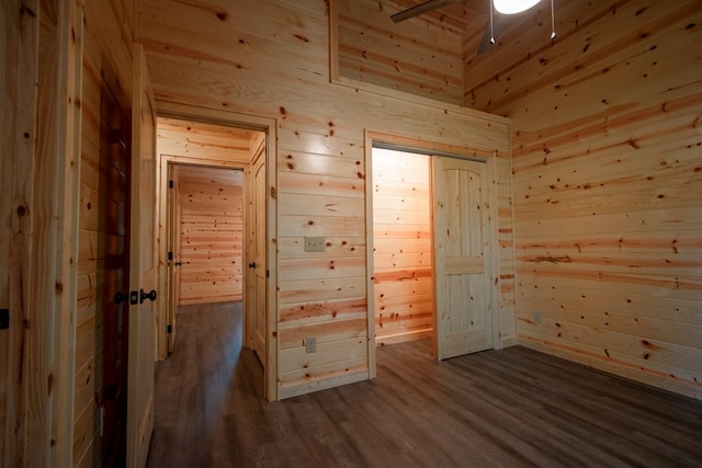 155 Stone Crest Ln, Murphy, NC 28906 - empty room with wooden walls, dark wood finished floors, and a ceiling fan
