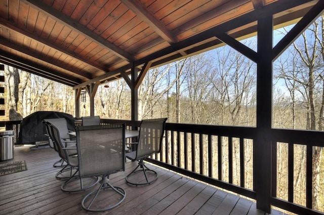 wooden deck featuring outdoor dining area