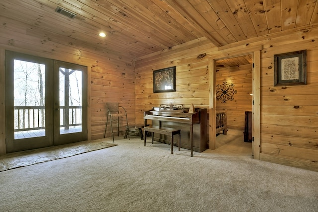 living area with french doors, carpet floors, wood ceiling, and visible vents